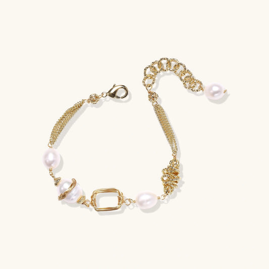 14K gold plated bracelet with freshwater pearls, filigree details, and mixed geometric elements on white background.