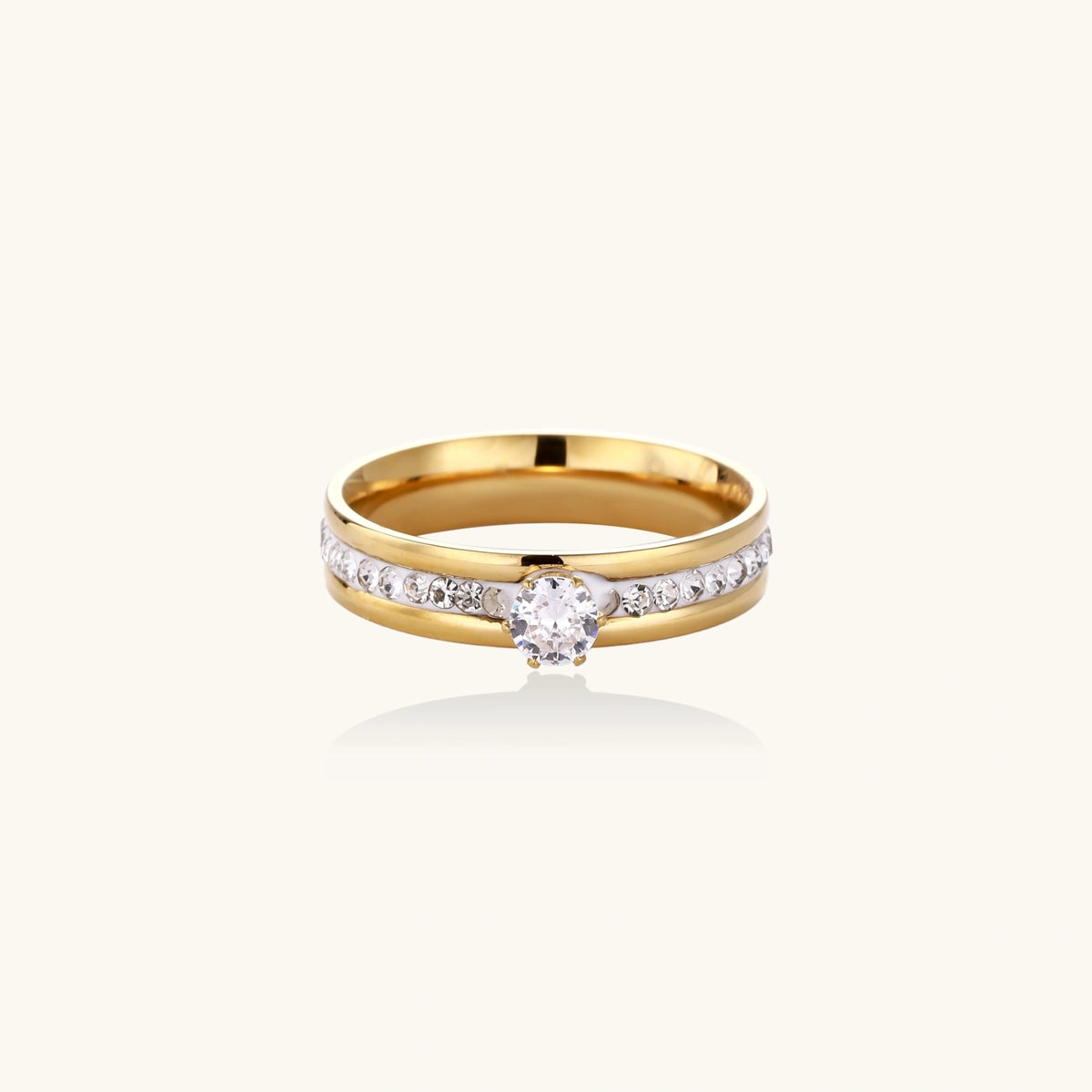 Gold-plated double-band ring with center rhinestone solitaire and channel-set stones on white background