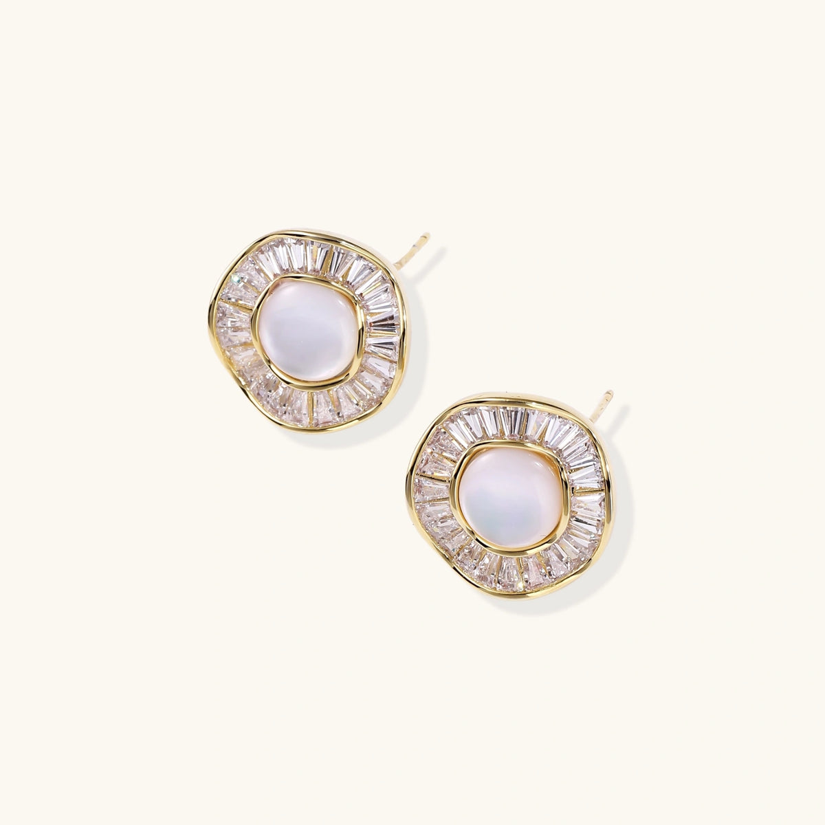 Gold-plated stud earrings with central freshwater pearl surrounded by radiating baguette crystals in sunburst design